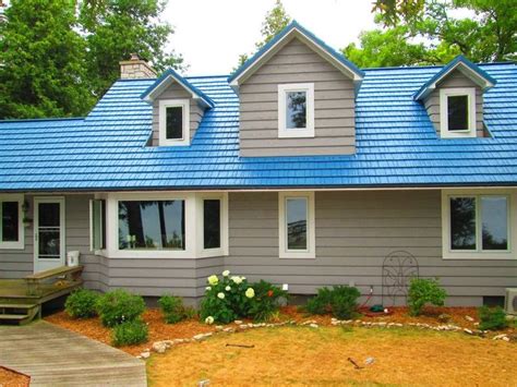 red house with blue metal roof|blue houses with red doors.